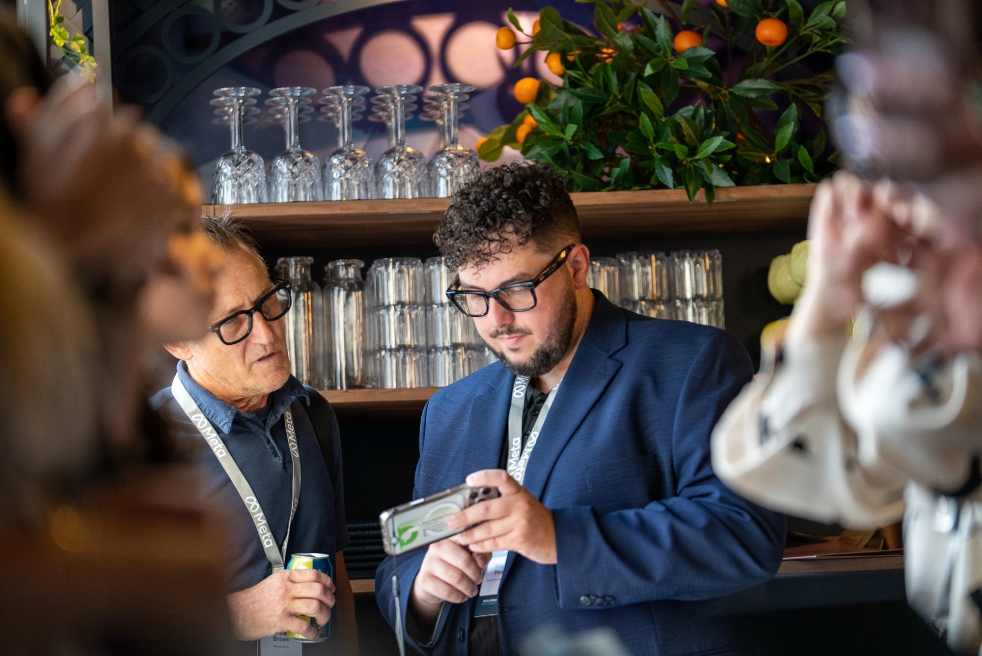 Trust Carbon founder Brayon Pieske demonstrates the verification platform on a smartphone to a fellow recipient at the Meta AI Glasses Impact Grant Community Summit